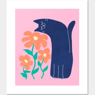 cat smelling flowers Posters and Art